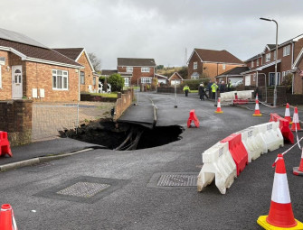 Residents told to avoid area after large sinkhole appears on housing estate Image