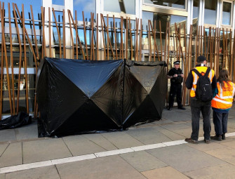 Climate activists clamp themselves to Scottish Parliament building Image