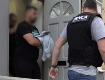 Inside dawn raids targeting London people smuggling gang as four arrested Image