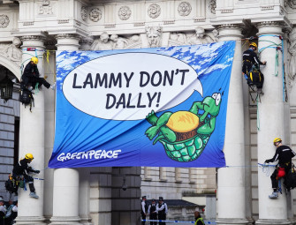 Four Greenpeace activists arrested after climbing Foreign Office building Image
