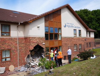 Two arrested after care home crash leaves eight in hospital Image