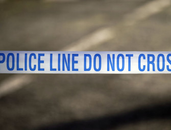 Teenager held on suspicion of murder after woman falls from block of flats Image