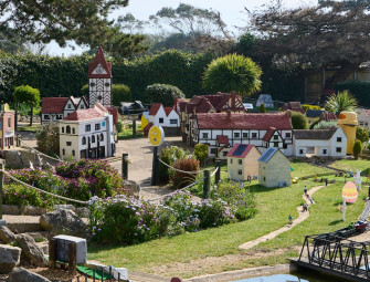  Playful pictures show a miniature Miliband and tiny Farage debating green issues in model village  Image