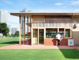 Wooden pillars support Blue Bottle Coffee cafe overlooking Tokyo Bay Image