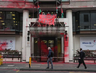 Palestine Action group spray red paint on Allianzs London office and occupy part of building Image