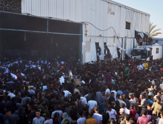 Four killed in Gaza as Palestinians storm UN warehouse in desperate search for food  Image