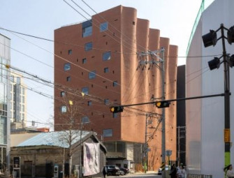 Curtain-like brick facade fronts W-Mission office in Seoul Image