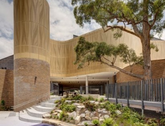 Fjcstudio wraps Sydney school in perforated aluminium facade Image