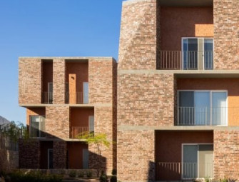 Jorge Urias unveils notched brick apartment complex in Mexico Image