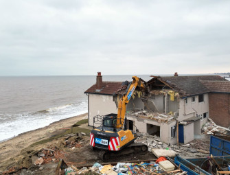 Demolition of six more homes begins in erosion-hit seaside village Image