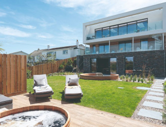  ‘I love seeing the surprise on people’s faces when they first walk in’ – couple transform small bungalow into a three-storey home with magnificent sea views  Image